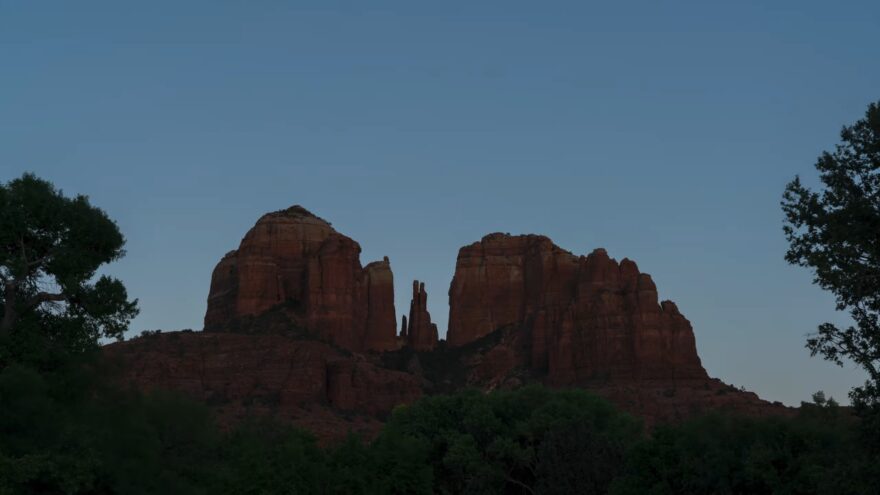 Cathedral Rock sits in shadow just before sunrise in Sedona