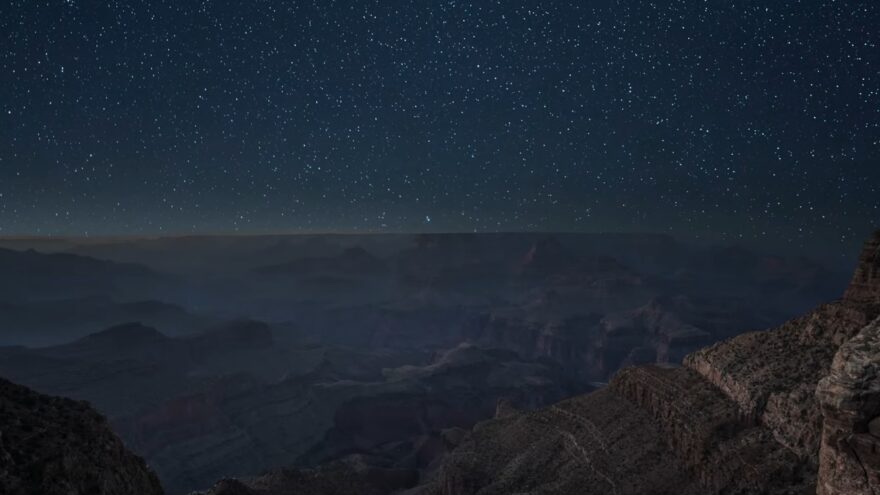 Stars fill the night sky above the desert landscape near Sedona