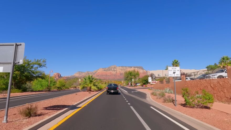 Red Rock Scenic Byway road near Sedona with red cliffs ahead